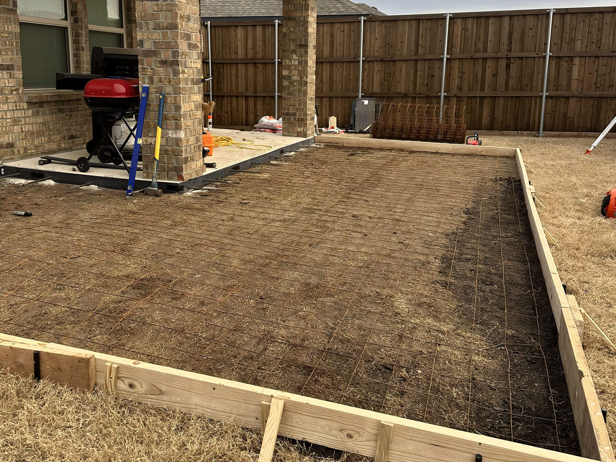 Wooden frame with rebar added to the patio for reinforcement.